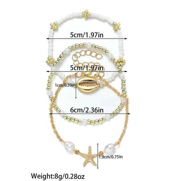 boho_pearl_and_shell_bracelet_wrist-shell bracelet- coastal look-beach style-shell jewerly-seashell jewelry-layered bracelet-cowrie bracelet