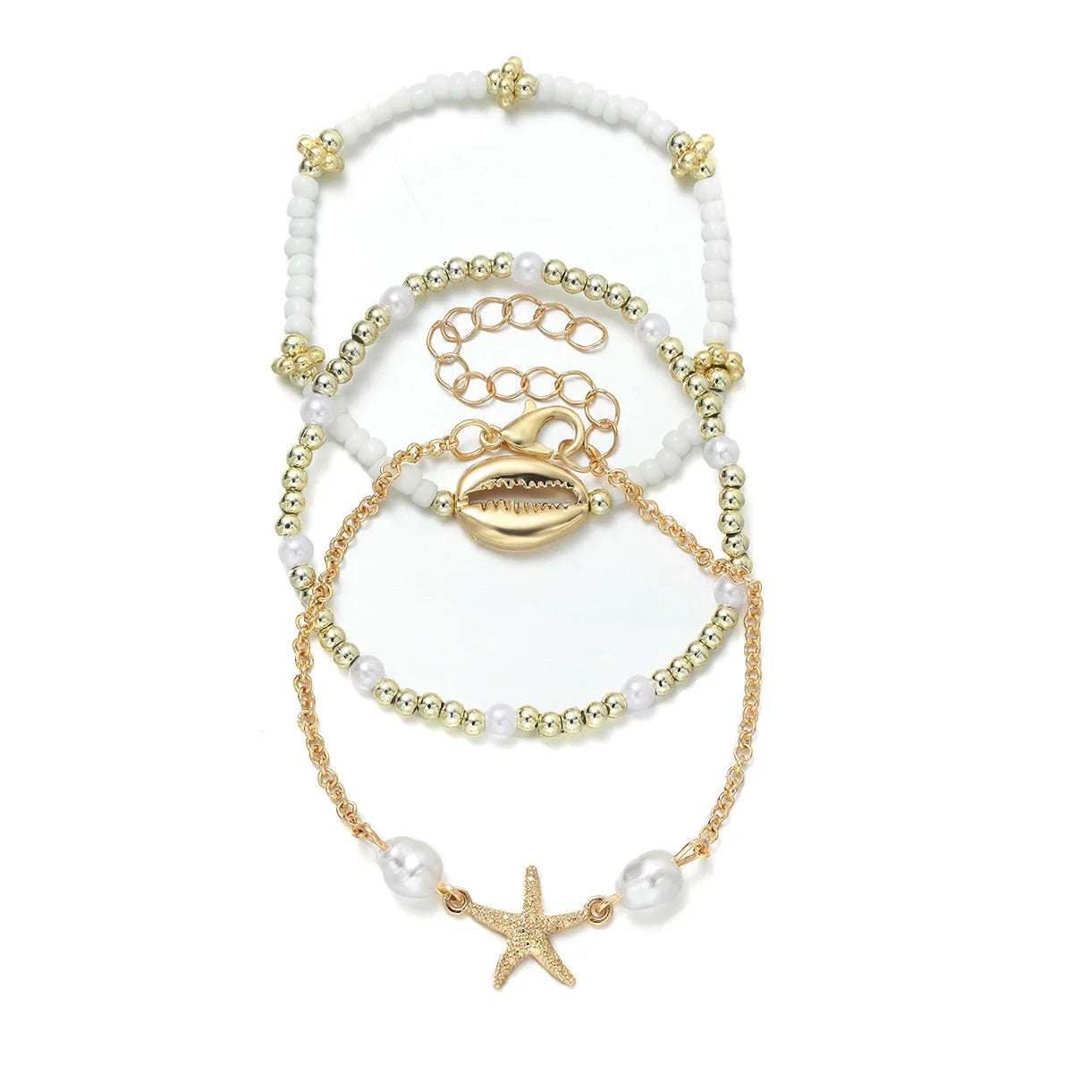 boho_pearl_and_shell_bracelet_wrist-shell bracelet- coastal look-beach style-shell jewerly-seashell jewelry-layered bracelet-cowrie bracelet