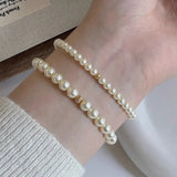 Dainty_Beaded_Pearl_Bracelet-shell jewelry-boho style-beach outfit-boho chic style-bohemian jewelry-coastal look-beach style-wedding style