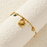 Gold_Cowrie_Shell_Rainbow_Gemstone_Bracelet-shell jewelry-boho style-beach outfit-boho chic style-bohemian jewelry-coastal look-beach style