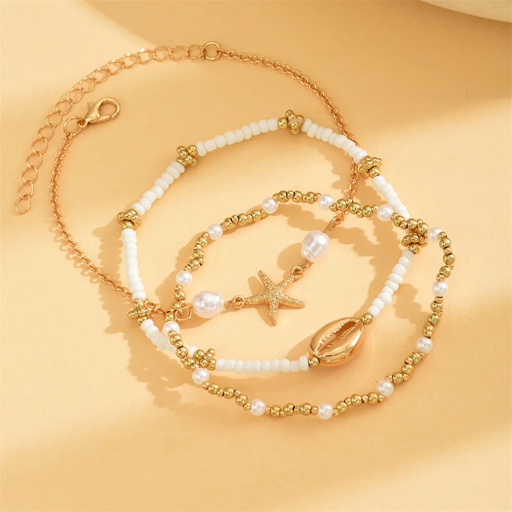 Layered Gold Starfish & Cowrie Shell Anklet Trio
