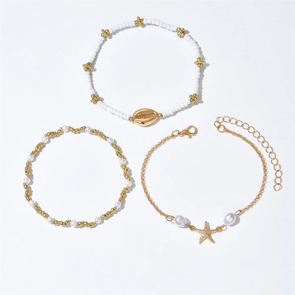 Layered Gold Starfish & Cowrie Shell Anklet Trio