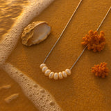 shell necklace- coastal look-beach style-shell jewerly-seashell jewelry-pearl necklace-gold pearl necklace
