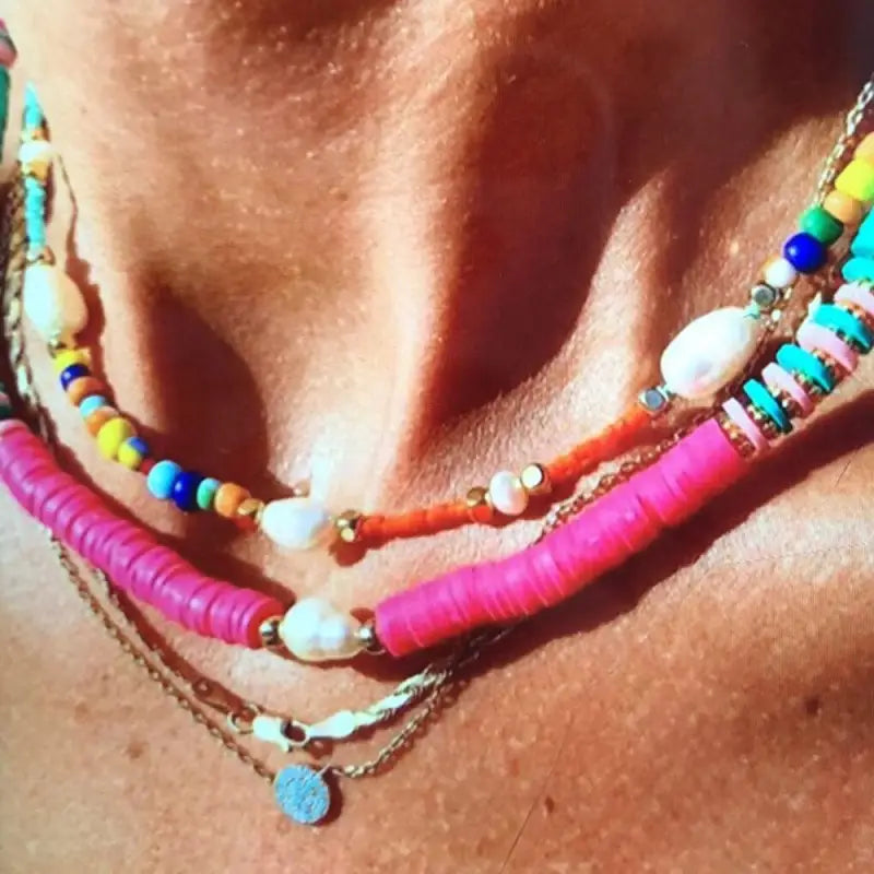 What are the benefits of wearing shell necklaces for energy and well-being?