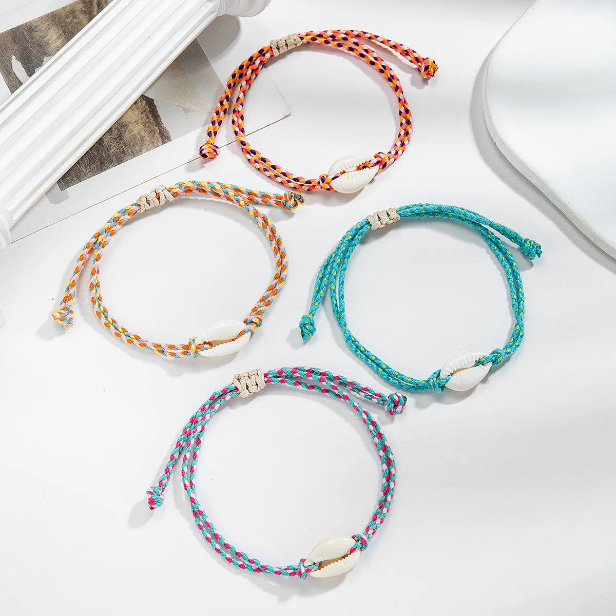Adjustable_Cowrie_Shell_Friendship_Bracelets-shell bracelet- coastal look-beach style-shell jewerly-
shell earrings-seashell jewelry-coastal jewelry-beach outfit-bohostyle-bohemian outfit