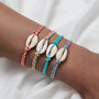 Adjustable_Cowrie_Shell_Friendship_Bracelets-shell bracelet- coastal look-beach style-shell jewerly-
shell earrings-seashell jewelry-coastal jewelry-beach outfit-bohostyle-bohemian outfit