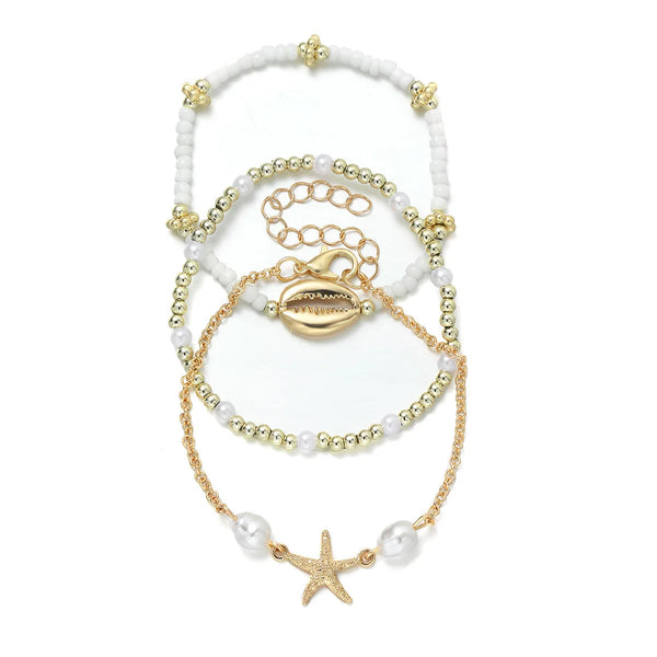 boho_pearl_and_shell_bracelet_wrist-shell bracelet- coastal look-beach style-shell jewerly-seashell jewelry-layered bracelet-cowrie bracelet