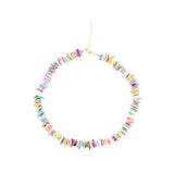 Multicolored beaded puka shell necklace on a white background