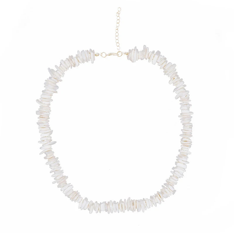 Necklace with white puka shell beads on a white background silver chain