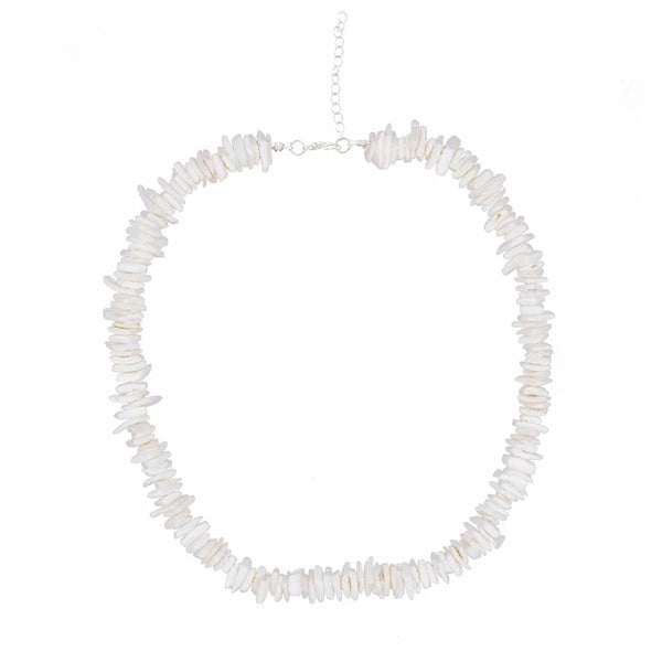 Necklace with white puka shell beads on a white background silver chain