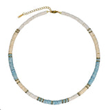  Blue and white natural shell necklace with gold accents shown flat, coastal style jewelry
