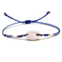 Drift & Glow Cowrie Bracelet for Boho Beach Souls_shell bracelet- 
coastal look-beach style-shell jewerly-
-seashell jewelry-coastal jewelry-beach outfit-bohostyle-bohemian outfit