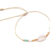Drift & Glow Cowrie Bracelet for Boho Beach Souls_shell bracelet- 
coastal look-beach style-shell jewerly-
-seashell jewelry-coastal jewelry-beach outfit-bohostyle-bohemian outfit