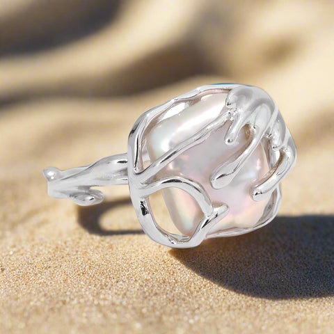 Entwined Pearl Ring on sand