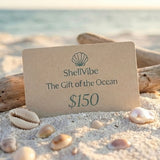 ShellVibe gift card on a beach with seashells and driftwood
