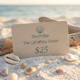 ShellVibe gift card on a beach with seashells and driftwood