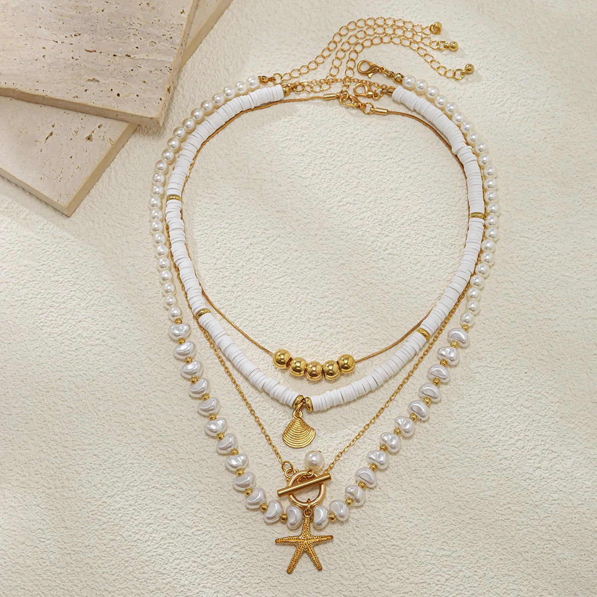 Gold_Starfish_Pearl_Layered_Shel-shell jewelry-boho style-beach outfit-boho chic style-bohemian jewelry-coastal look-beach style
