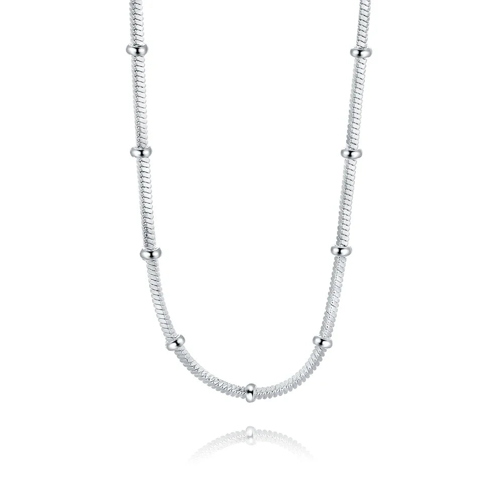 Silver necklace with small beads on a white background