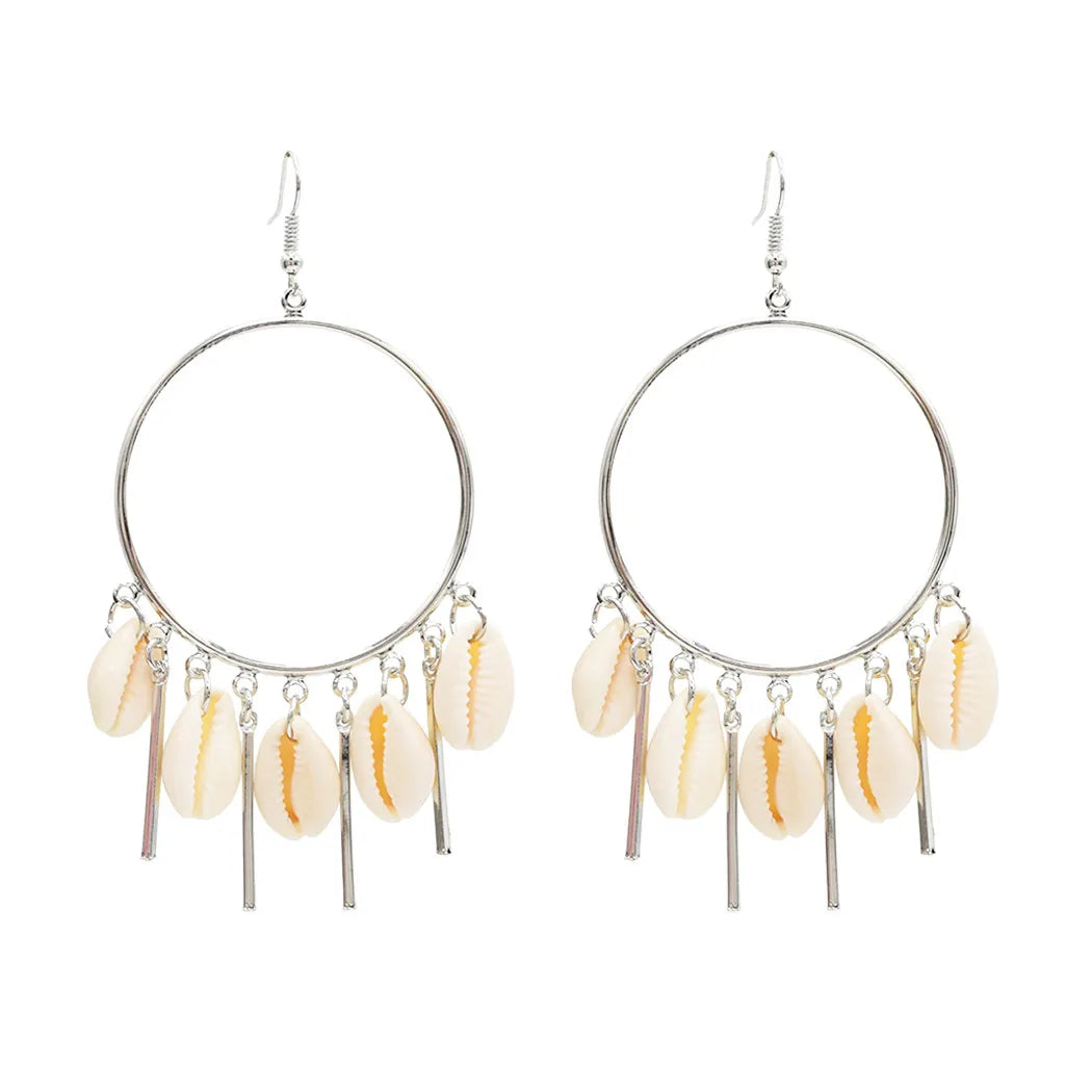Cowrie Hoop earrings with shell beads on a white background