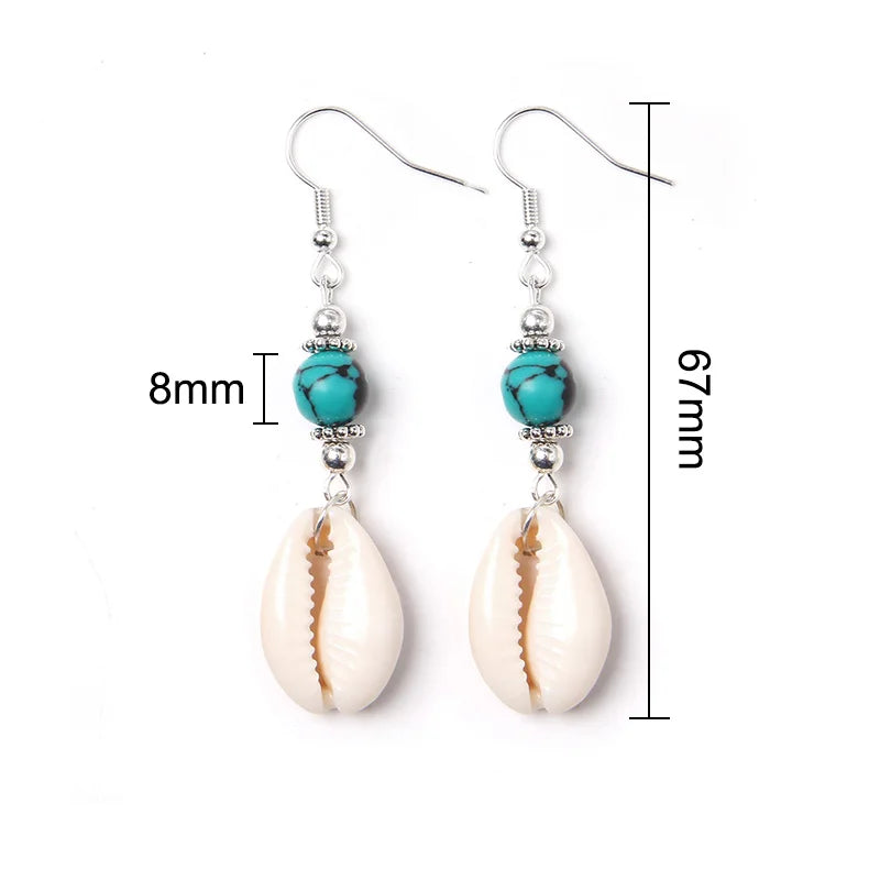 Shell earrings with turquoise beads and measurements on a white background