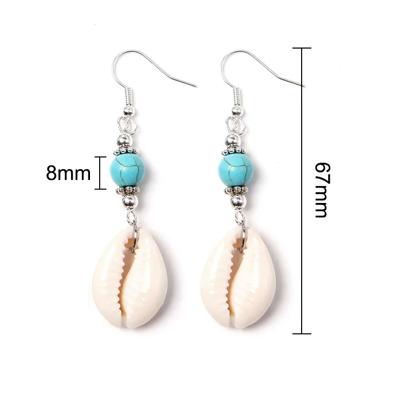 Shell and turquoise bead earrings with measurements on a white background