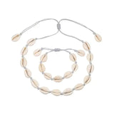 A Cowrie Necklace and Bracelet Set with white and brown cowrie shells linked together on a fine cord with a sliding clasp.