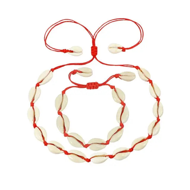 A Cowrie Necklace and Bracelet Set with white and brown cowrie shells linked together on a fine cord with a sliding clasp.