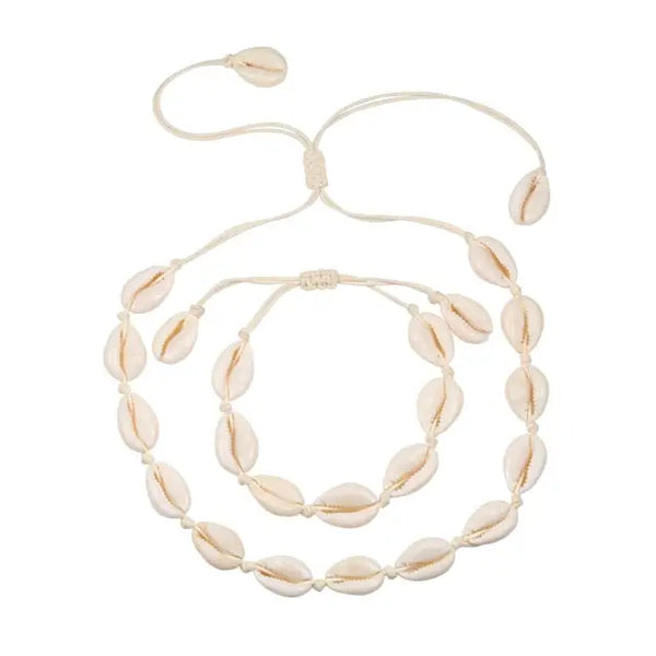 A Cowrie Necklace and Bracelet Set with white and brown cowrie shells linked together on a fine cord with a sliding clasp.