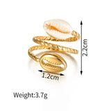 Gold shell ring with measurements and weight on a white background
