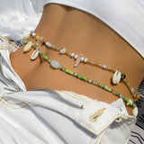 Whispers_of_the_Shoreline_Green_Shell_Belly_Chain_for_Boho_Beach_Days-coastal look-beach style-shell jewerly-
shell earrings-seashell jewelry-coastal jewelry-beach outfit-bohostyle-bohemian outfit
