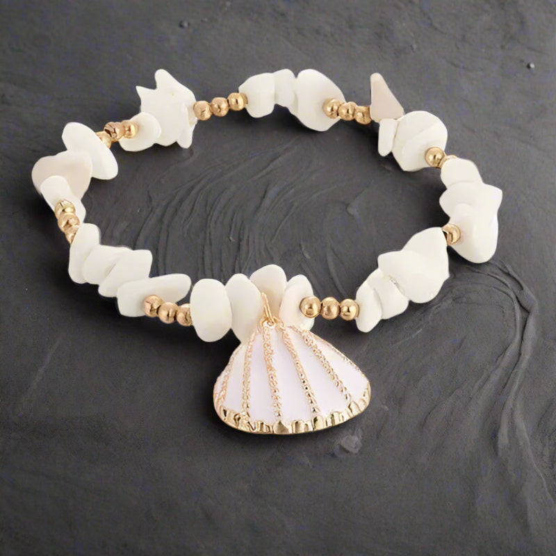 peux tu suspendre cette bague, zoom sur la bague a une branche de bois flotté, sunset, beach