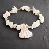 peux tu suspendre cette bague, zoom sur la bague a une branche de bois flotté, sunset, beach
