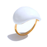 Ring with a white stone and gold band on a white background